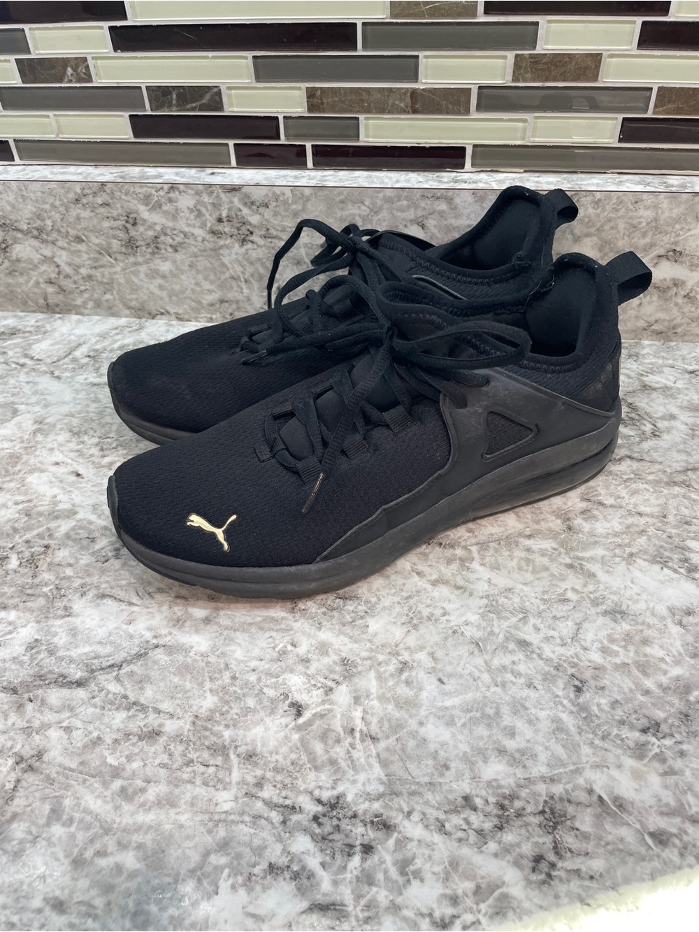 PUMA black & gold sneakers size 8.5 women’s